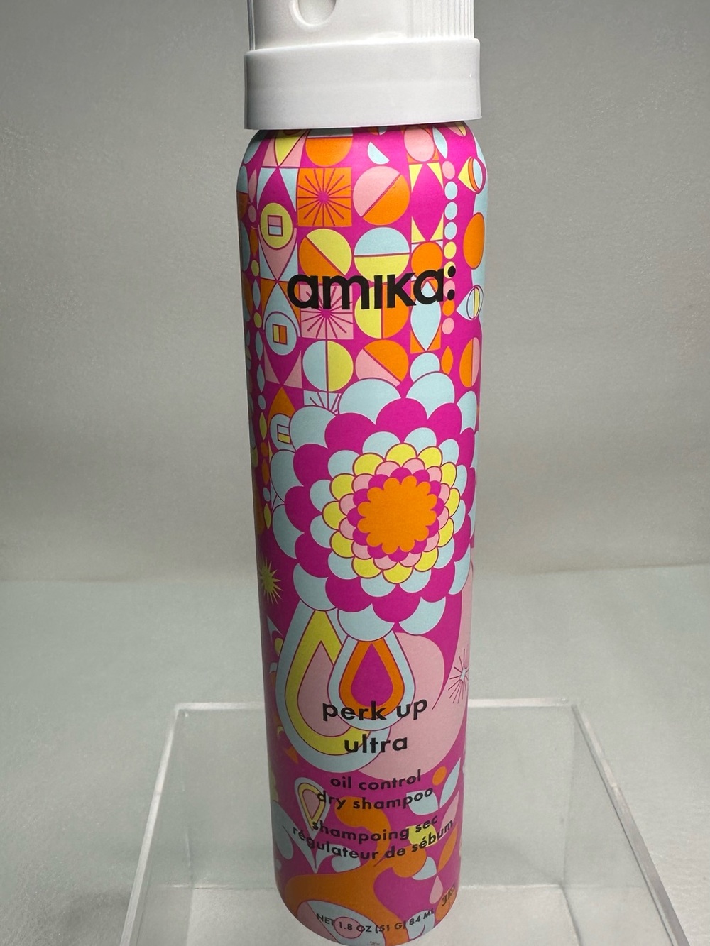 amika Dry Shampoo Canister in Pink, Orange, Yellow and Blue Floral Pattern